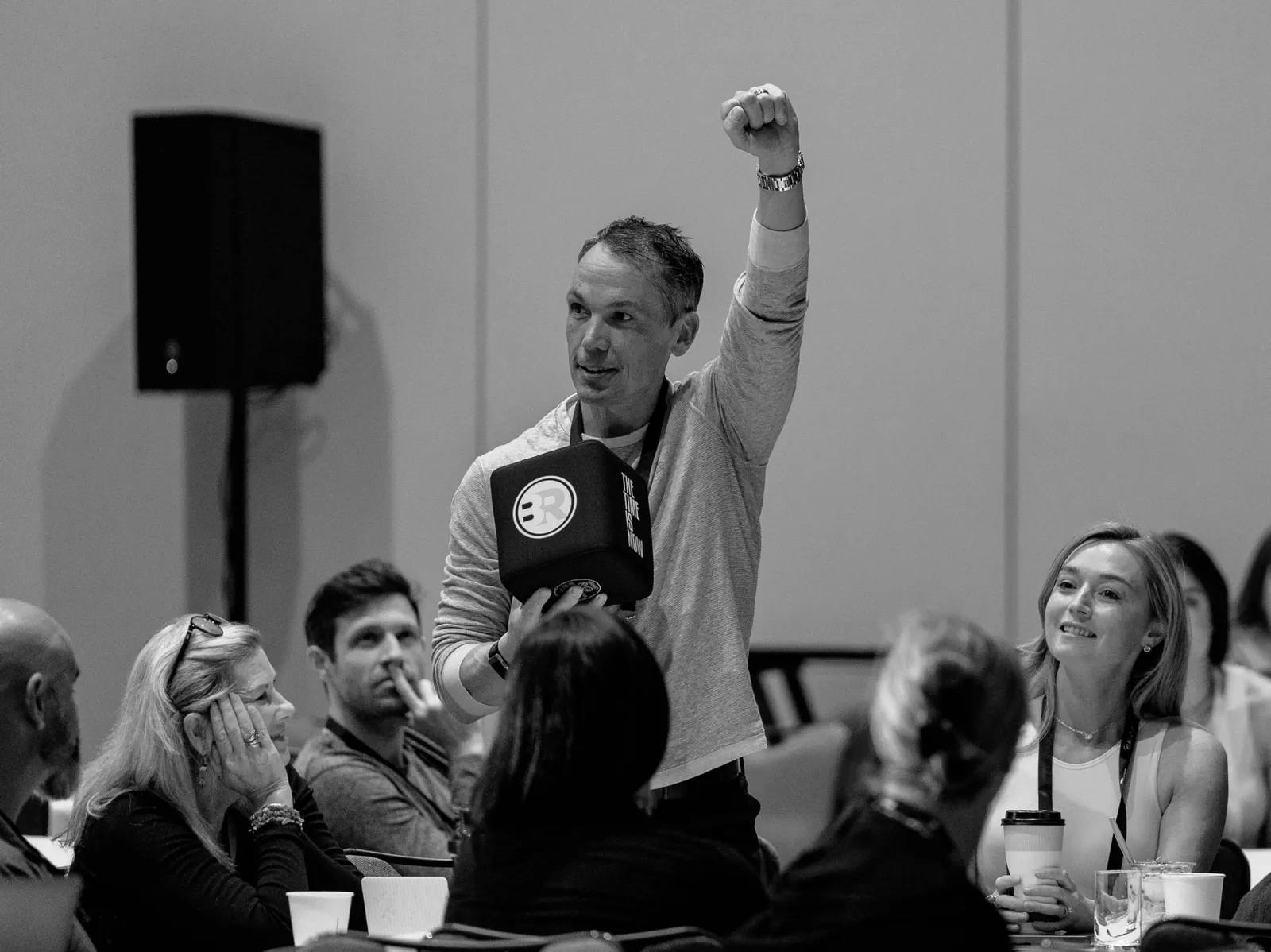 Member with raised fist — moment of conviction