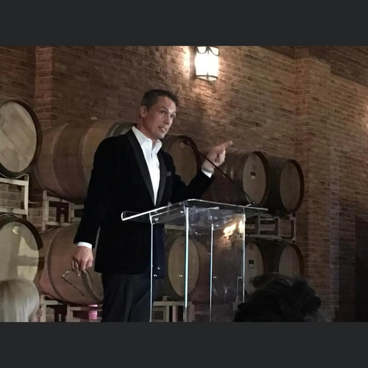 Roger Burnett speaking at a podium
